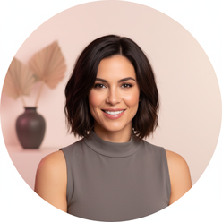 Portrait of Sloane V., an influencer, smiling gently at the camera. She has a modern hairstyle and wears a stylish top.